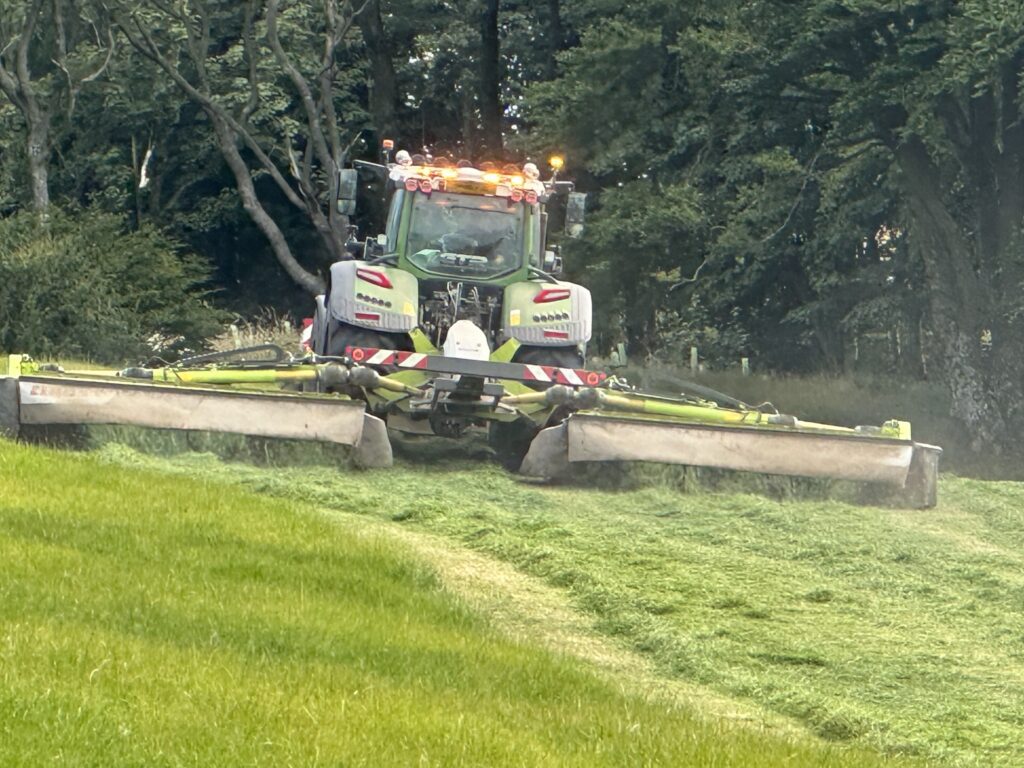 Mowing fields for silage at Orroland in mid-summer
